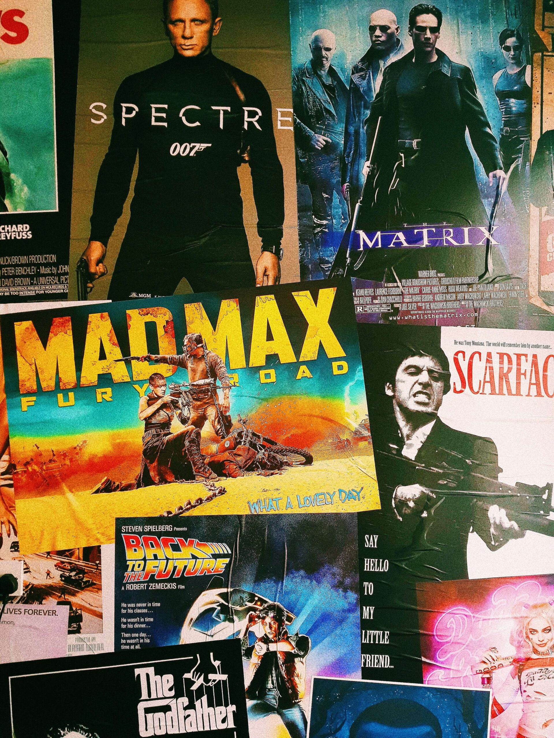 movie posters for Mad Max, Scarface, Spectre, and more